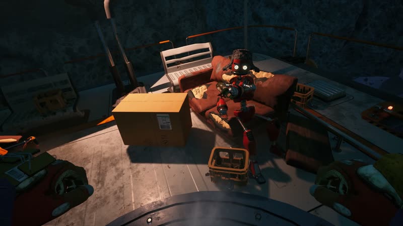 A small retro robot with glowing eyes sits on a couch in a cluttered ship cabin