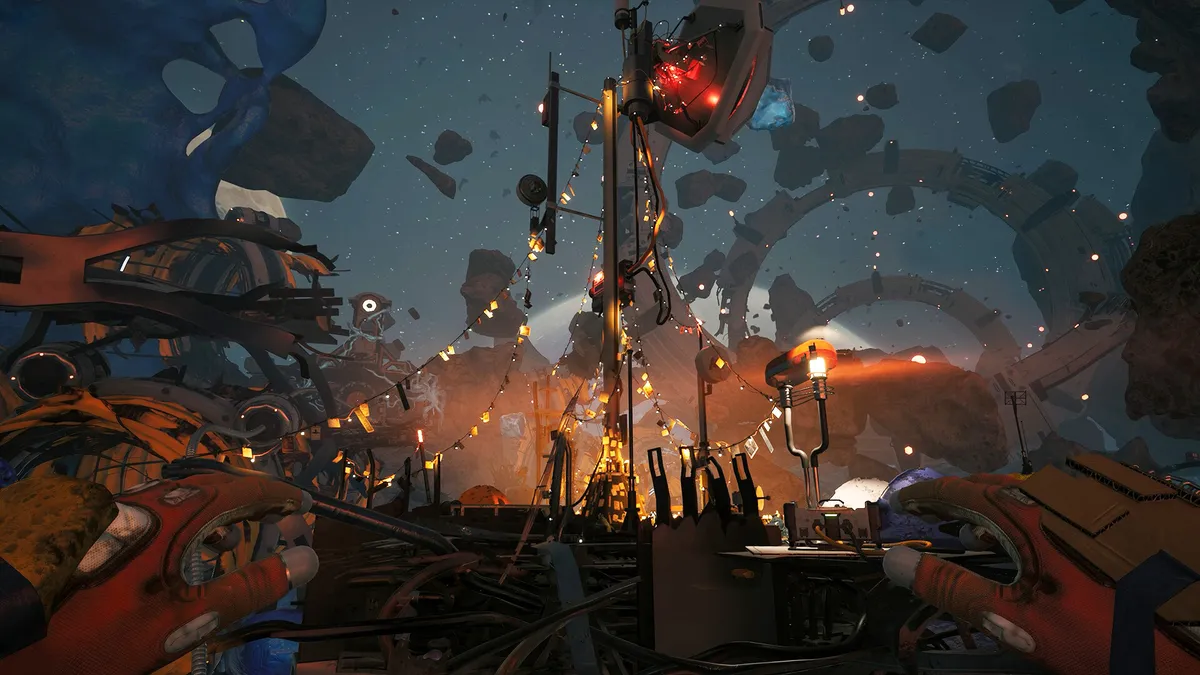 A spacewalk leg past a lit outpost, seen from behind orange gloves