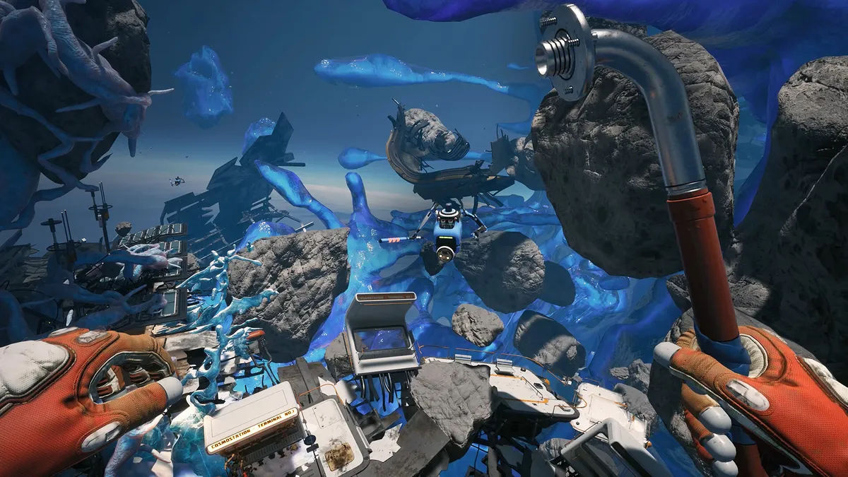 A spacewalk through a debris field of wrecks and blue cryogel, orange gloves in frame